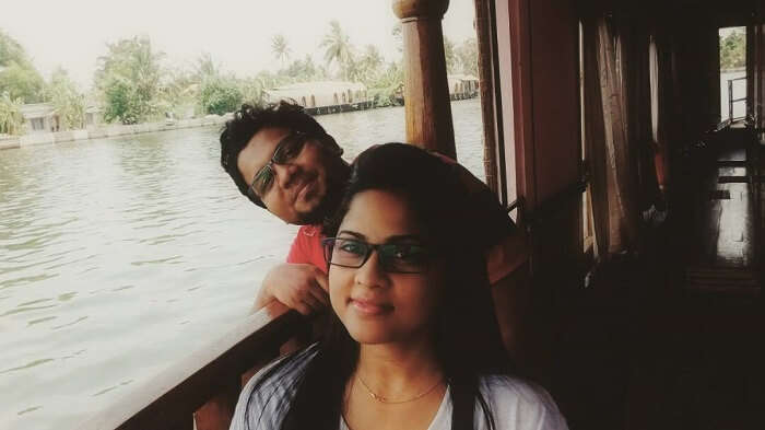 couple cruising on backwaters in Kerala