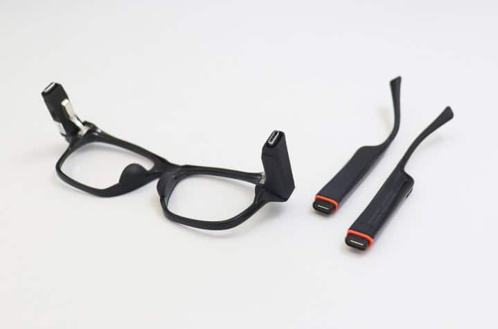 A promotional image of the modular pieces of the Solos AirGo Vision smart glasses.