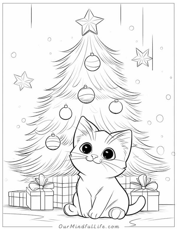 Cute baby cat by the Christmas tree