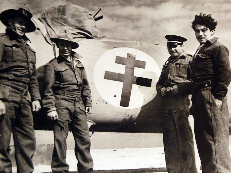 Two Australian soldiers and two French French airman stand alongside a Bristol Blenheim in north Africa, c. 1940. National Museum of the United States Navy. Public Domain.