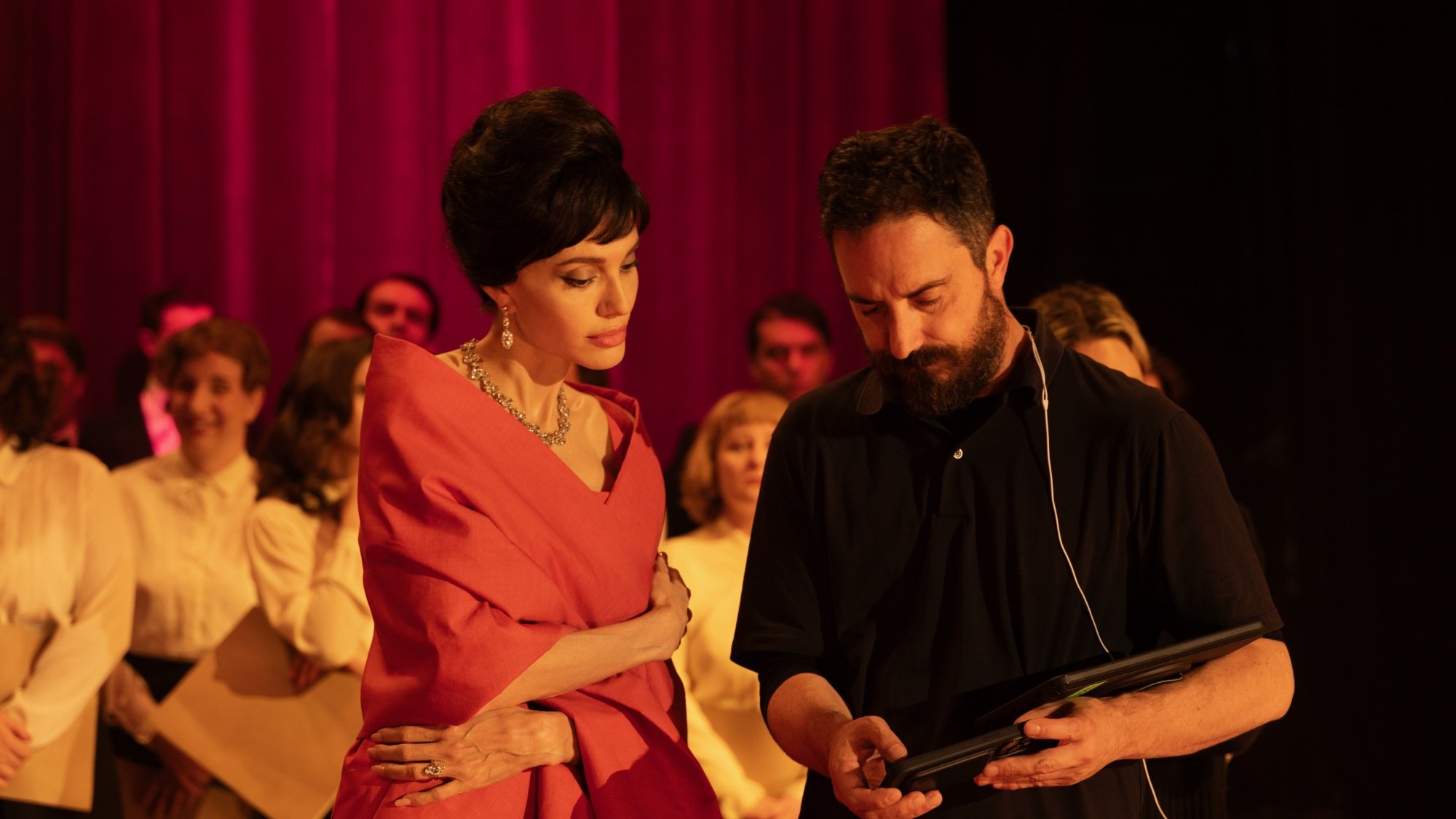 Pablo Larraín and Angelina Jolie discuss a scene on the set of "Maria."