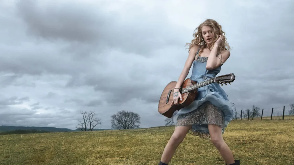 Taylor Swift in vintage attire gazing at the horizon in the "Wildest Dreams" music video