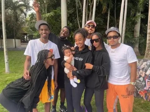 Diddy / Instagram Sean Combs (back row, third from left) poses with his seven children, in a photo he posted on Instagram in March 2023