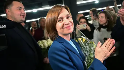 Getty Images Moldova’s President Maia Sandu smiles after her re-election