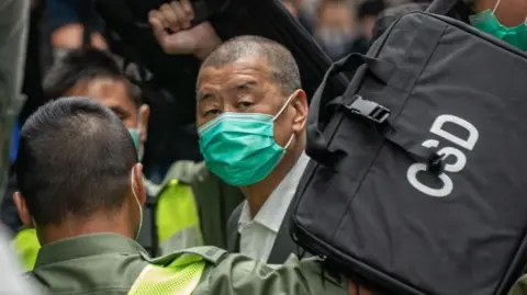 Getty Images Jimmy Lai, Apple Daily founder, arrives at the Court of Final Appeal ahead a bail hearing on February 9, 2021